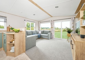 TV - Three bedroom caravan, sleeping six people, perfect for relaxing by the coast. (Clarach)