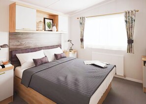 Unclassified image, 5 of 14, button - Two bedroom caravan, sleeping four people, perfect for relaxing by the coast. (Clarach)