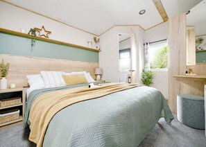 Unclassified image, 2 of 14, button - Two bedroom caravan, sleeping four people, perfect for relaxing by the coast. (Clarach)