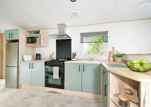 Private kitchen - Two bedroom caravan, sleeping four people, perfect for relaxing by the coast. (Clarach)