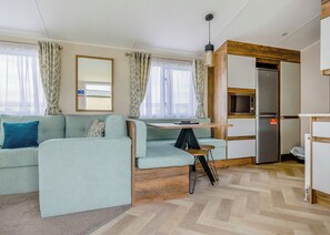 Living area - 12ft-wide very comfortable and spacious caravan with one double and one twin. (Mablethorpe)