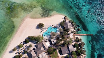 On the beach, white sand, free beach cabanas, sun loungers