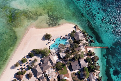 On the beach, white sand, free beach cabanas, sun loungers