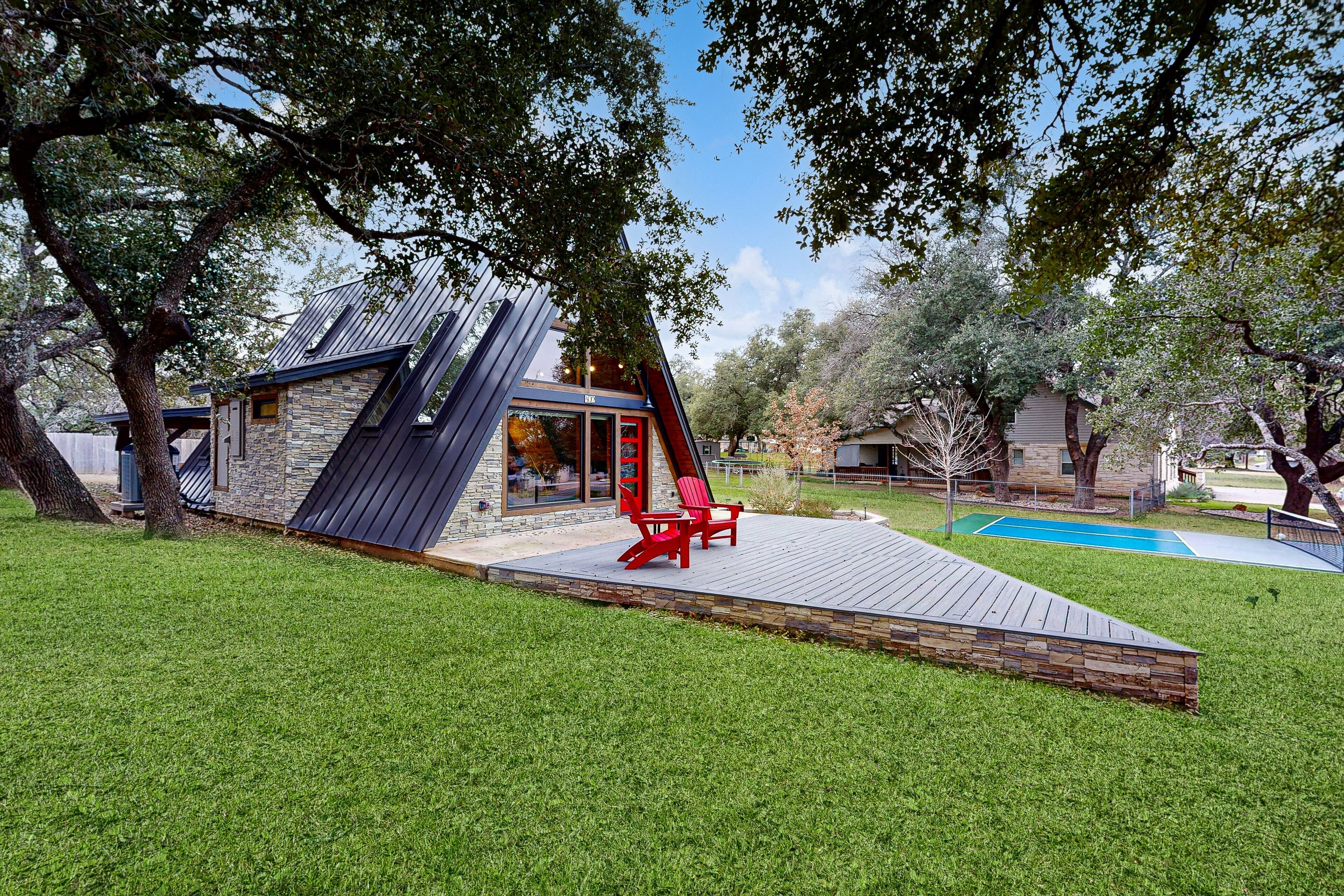 Unique retreat with pickleball, cornhole, decks, grill, fireplace, AC, & W/D