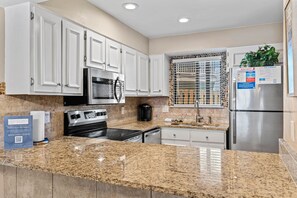 Fridge, microwave, oven, stovetop - Steps from the Beach! Loads of Amenities! (Panama City Beach)