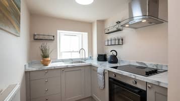 Oven, toaster, cookware/dishes/utensils, dining tables