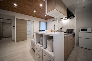 Apartment | Private kitchen | Microwave, stovetop, rice cooker, cookware/dishes/utensils