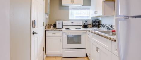 Fridge, microwave, stovetop, coffee/tea maker