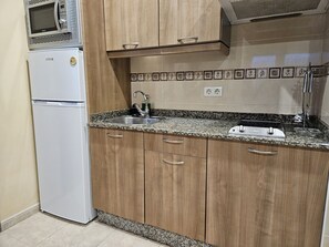 Fridge, microwave, toaster, cookware/dishes/utensils