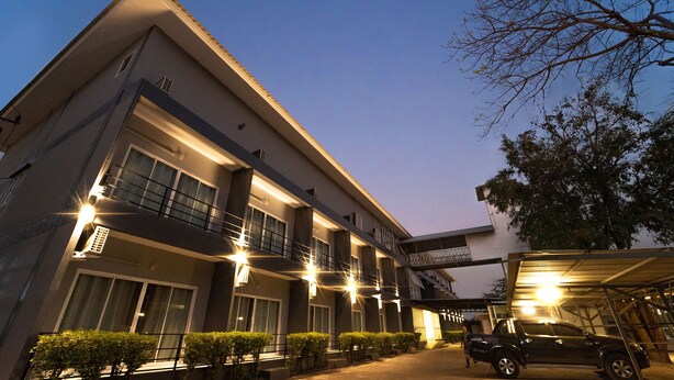 A multi-story hotel with a modern design, featuring balconies and large windows. - B2 Nakhon Sawan Boutique & Budget Hotel (Nakhon Sawan)