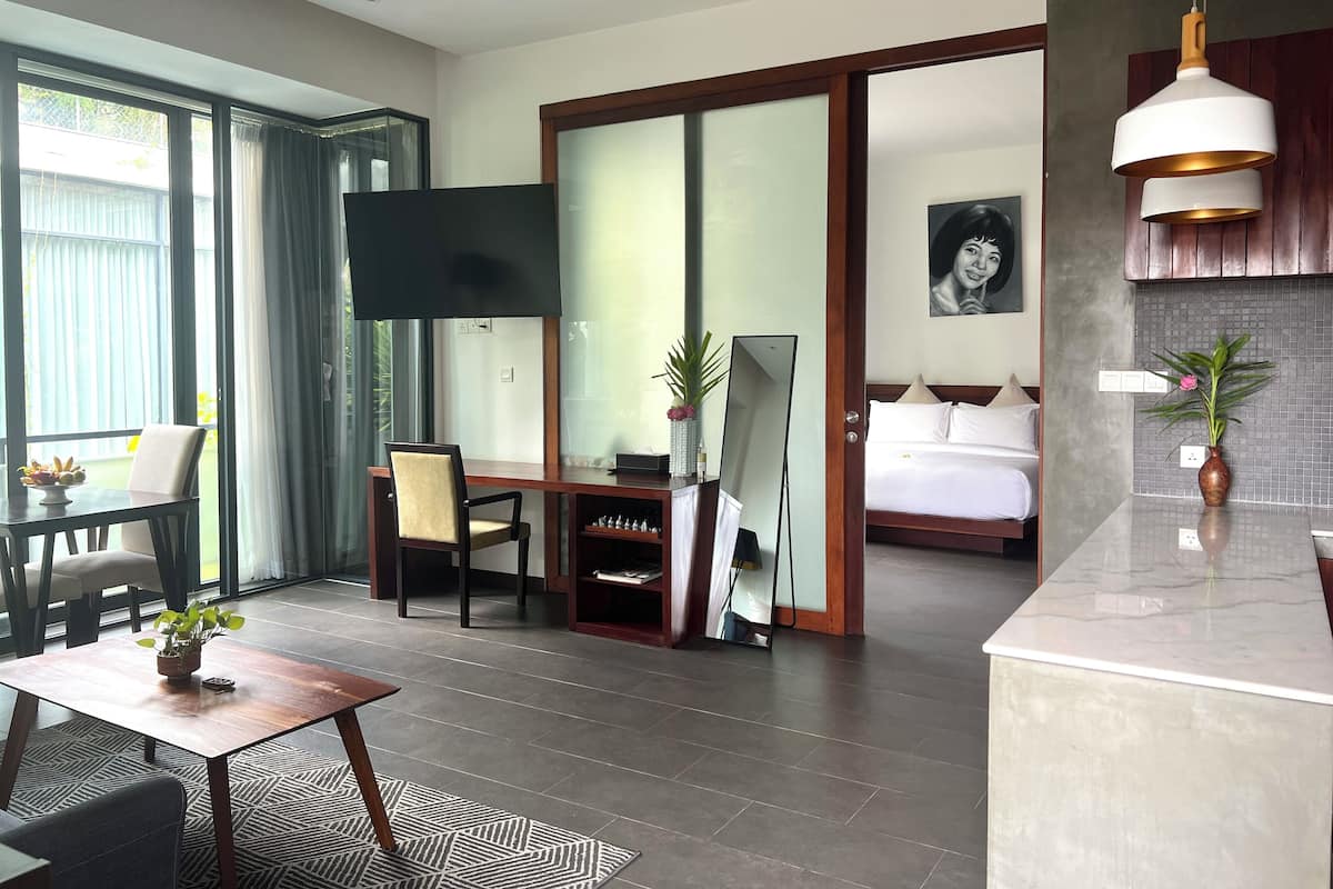 Signature Suite, 1 Bedroom, Balcony, Pool View | Living area | Smart TV