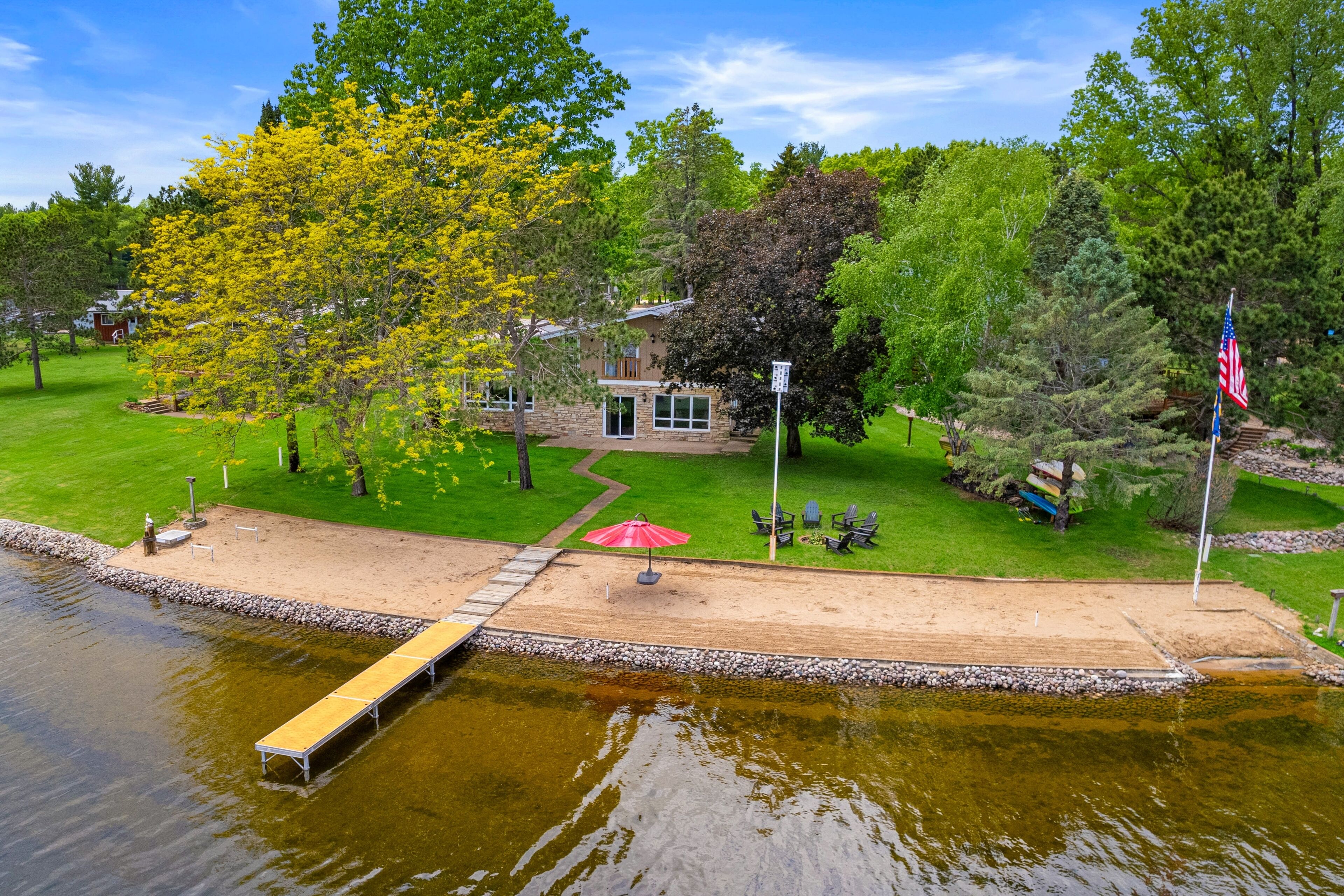 Lakefront hideaway with private beach, seasonal dock, washer/dryer, & AC