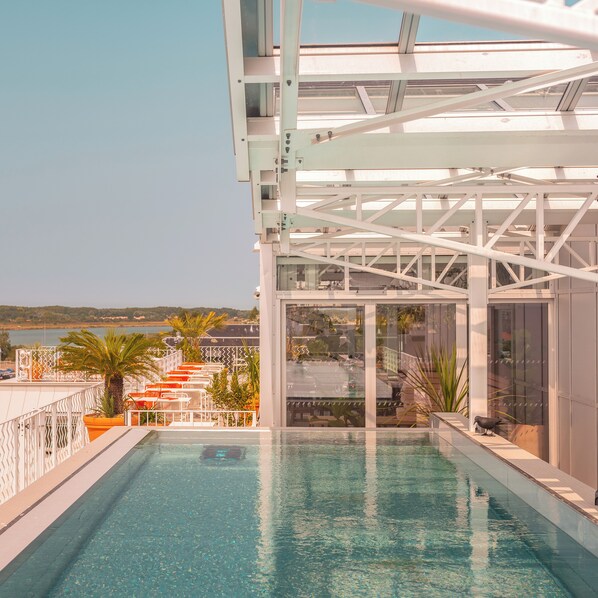 Seasonal outdoor pool, pool loungers