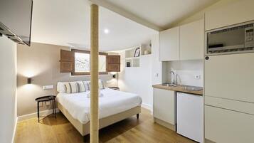 Premium bedding, down comforters, desk, laptop workspace