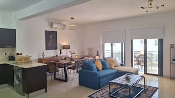 Family Apartment | Living area | 50-inch Smart TV with cable channels