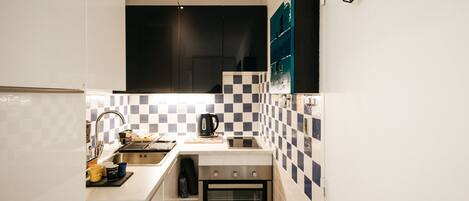 Fridge, microwave, stovetop, coffee/tea maker