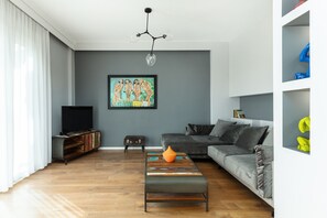 Apartamento urbano | Área de estar | Smart TV 40 polegadas com canais a cabo