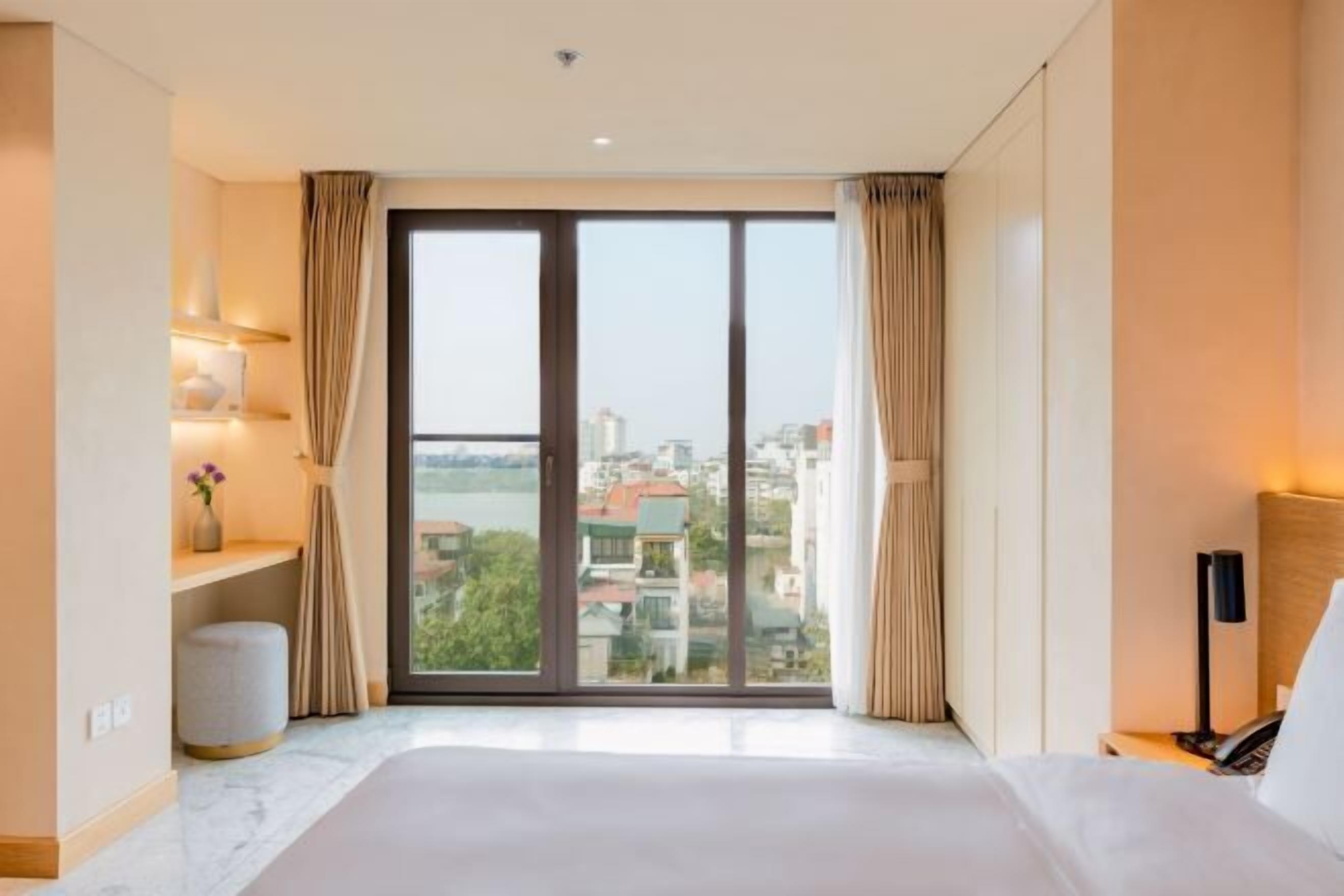 Premium bedding, down comforters, desk, laptop workspace