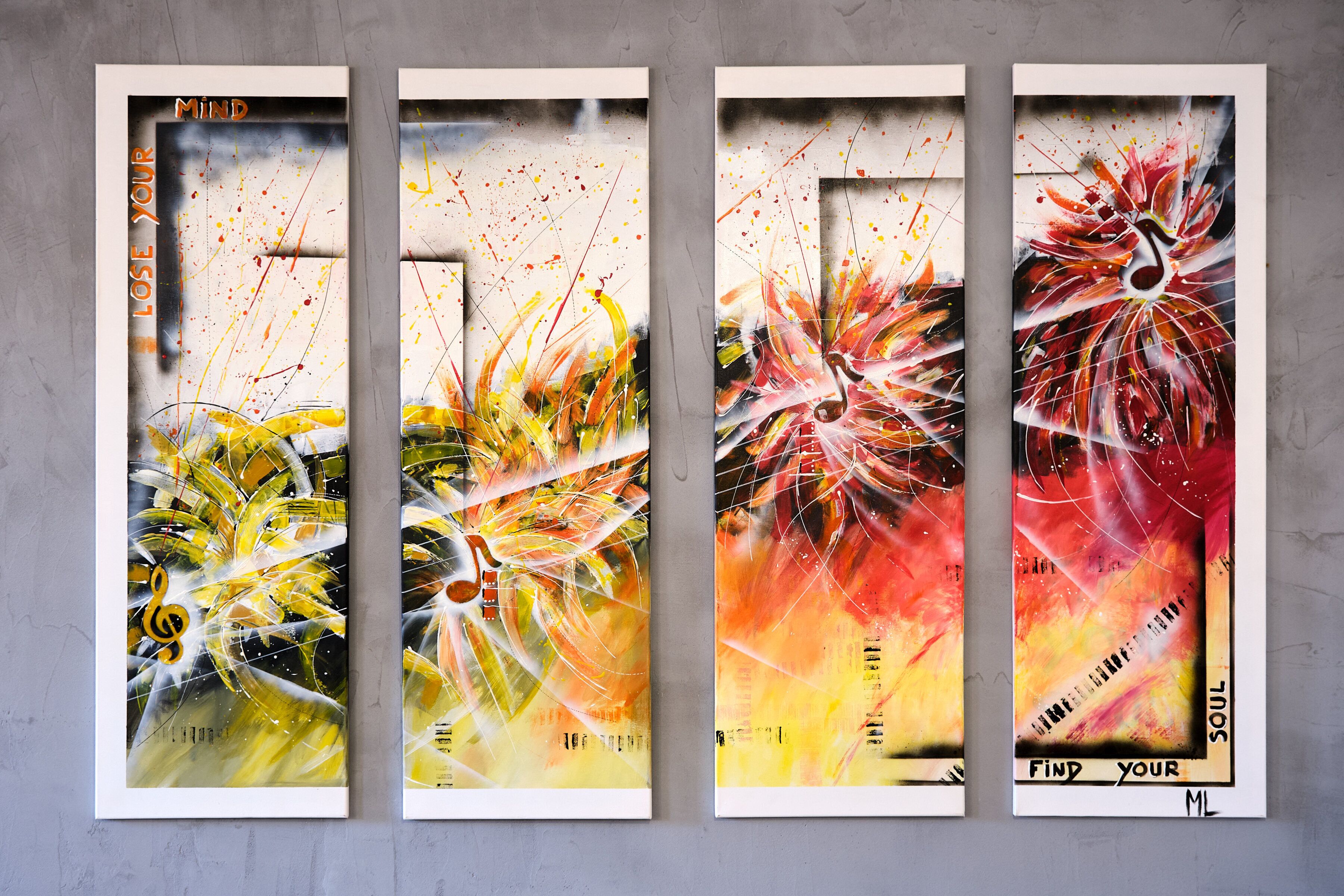 Four framed abstract paintings with text on the top and bottom.