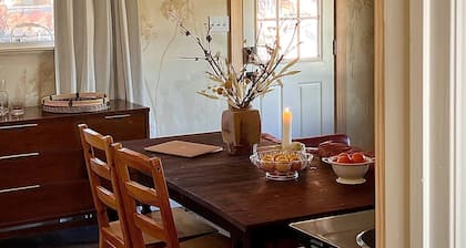 A private king studio with a kitchenette in the garden of Halliday House.