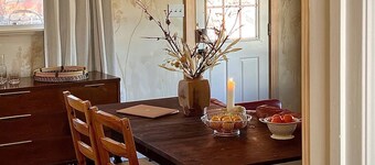 A private king studio with a kitchenette in the garden of Halliday House.