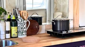 Fridge, microwave, coffee/tea maker, cookware/dishes/utensils