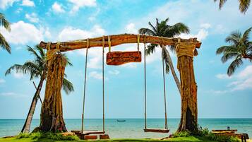 On the beach, sun-loungers, beach umbrellas, beach towels