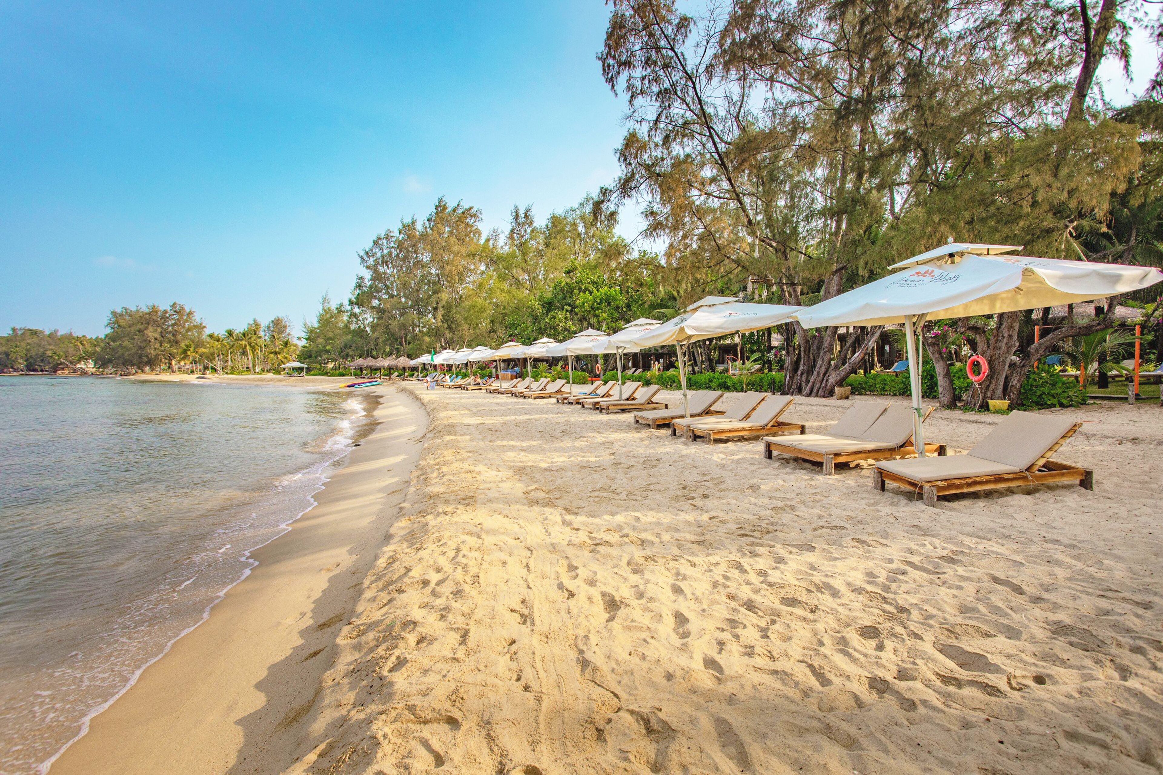 On the beach, sun-loungers, beach umbrellas, beach towels