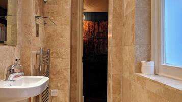 Shower, hair dryer, towels, shampoo