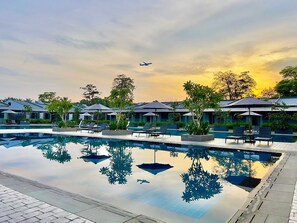 Outdoor pool, open 6:00 AM to 10:00 PM, free cabanas, pool umbrellas