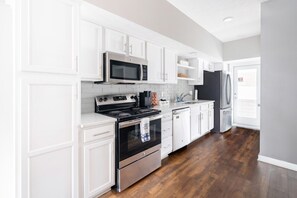 Fridge, microwave, oven, stovetop - Luxury Downtown Townhome w/ Private Garage Unit 7 (Cleveland)