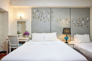 Deluxe Triple Room, No Windows | Minibar, in-room safe, desk, blackout drapes