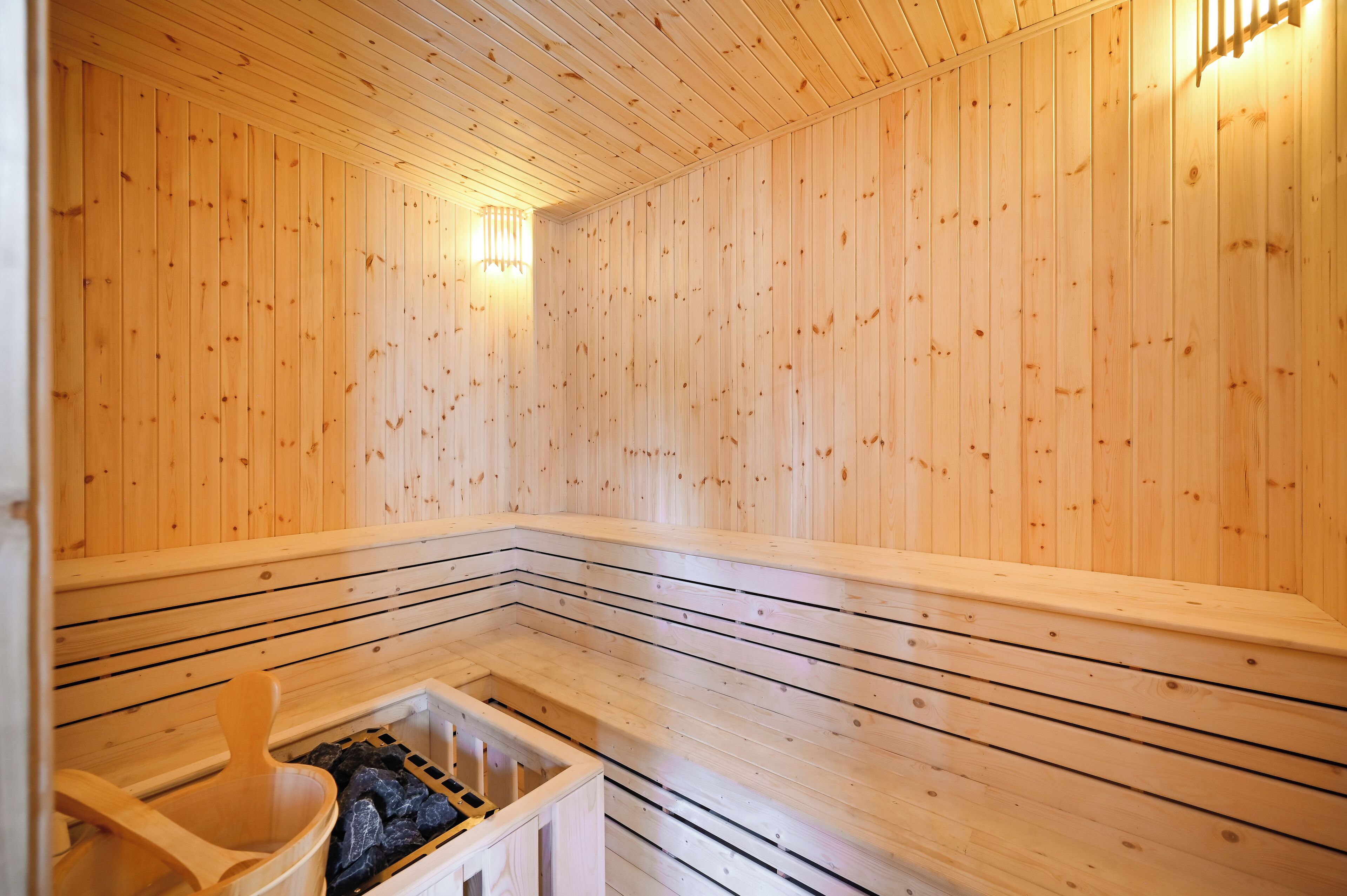A sauna with wooden walls and benches.
