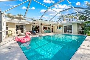 Outdoor pool, a heated pool - Waterfront Heated Pool w/ Boat Dock & Cosmic Mini Gof  - 4bd 2ba Paradise Found (Cocoa Beach)