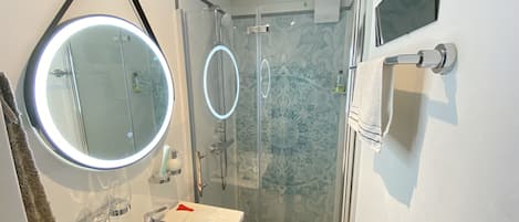 Shower, hair dryer, towels, soap