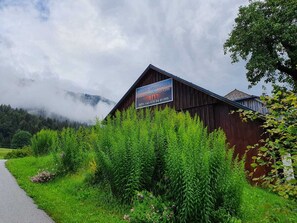 Set amidst lush greenery, this charming property offers a serene mountain retreat.