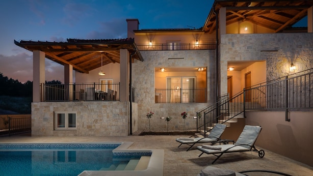 A modern two-story house with a stone facade, a swimming pool, and outdoor seating. - Villa San Zadarvillas (Sveti Filip i Jakov)