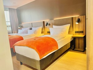 Literie hypoallergénique, coffres-forts dans les chambres, bureau