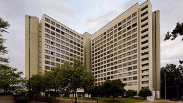A large, modern building with multiple floors and a symmetrical design.