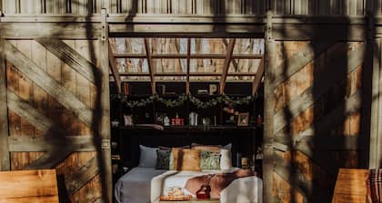 Enjoy the simplicity and elegance of a cozy bedroom in the woods.