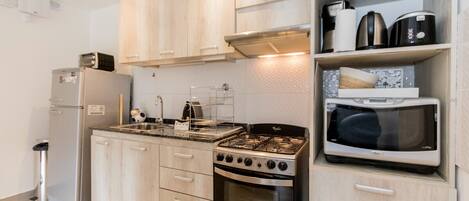 Comfort Apartment | Private kitchen | Full-sized fridge, microwave, oven, toaster