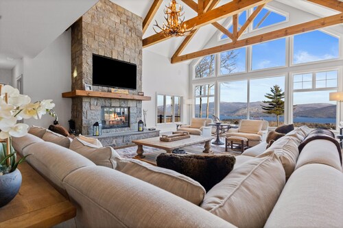 Panoramic lake view acreage with game room, sauna & fireplace