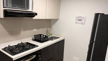 Fridge, microwave, oven, cookware/dishes/utensils