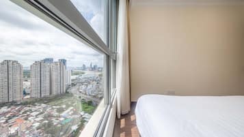Departamento Deluxe, 2 habitaciones, balcón, vista a la ciudad | 2 habitaciones y ropa de cama de alta calidad