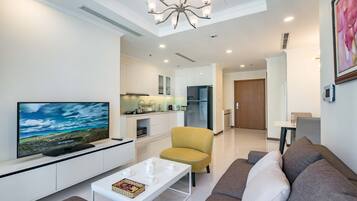 Deluxe Apartment, 1 Bedroom, Balcony, City View | Living area | 42-inch Smart TV with cable channels