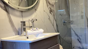Shower, rainfall showerhead, towels, soap