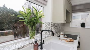 Fridge, electric kettle, cookware/dishes/utensils