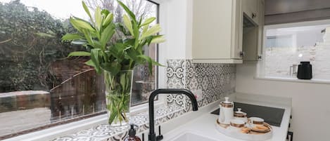 Fridge, electric kettle, cookware/dishes/utensils