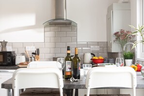 Fridge, electric kettle, toaster, cookware/dishes/utensils