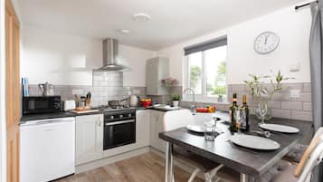 Fridge, electric kettle, toaster, cookware/dishes/utensils